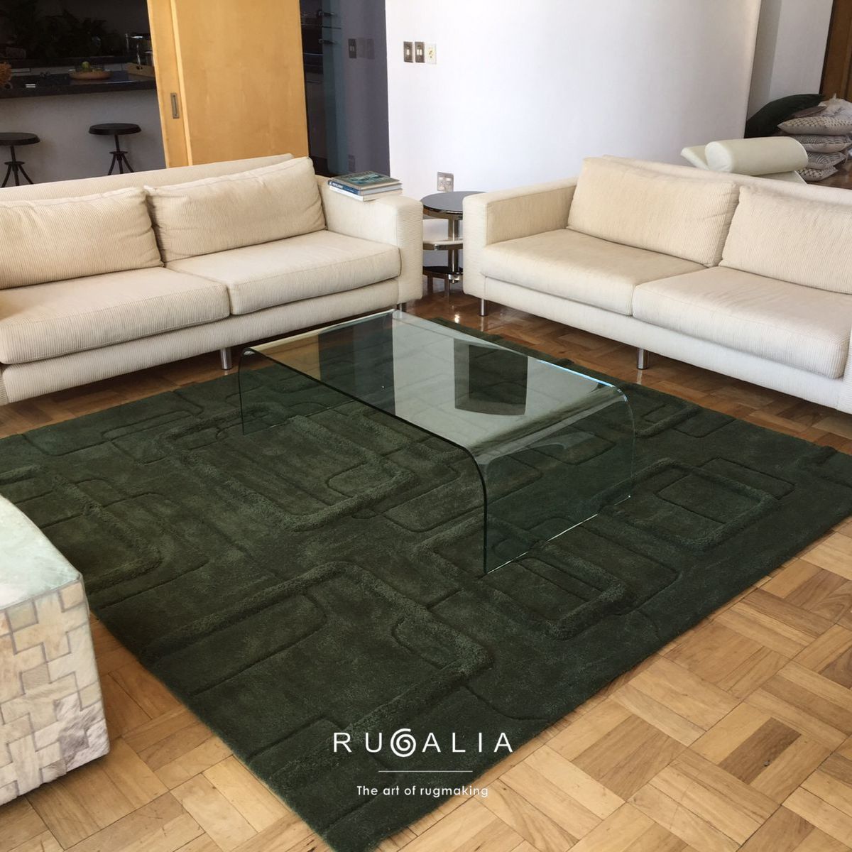 an emerald green rug handtufted in multiple cut pile