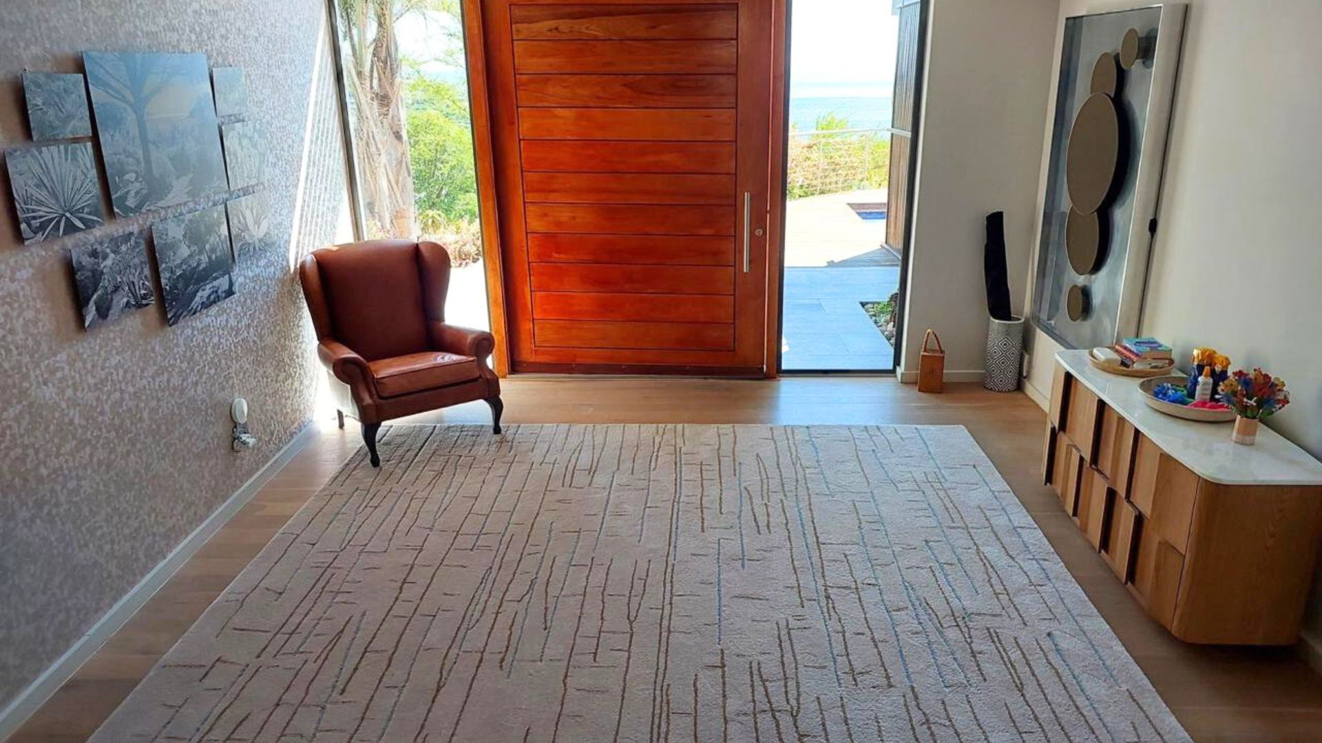 Handtufted rug placed at the entrance way of a home