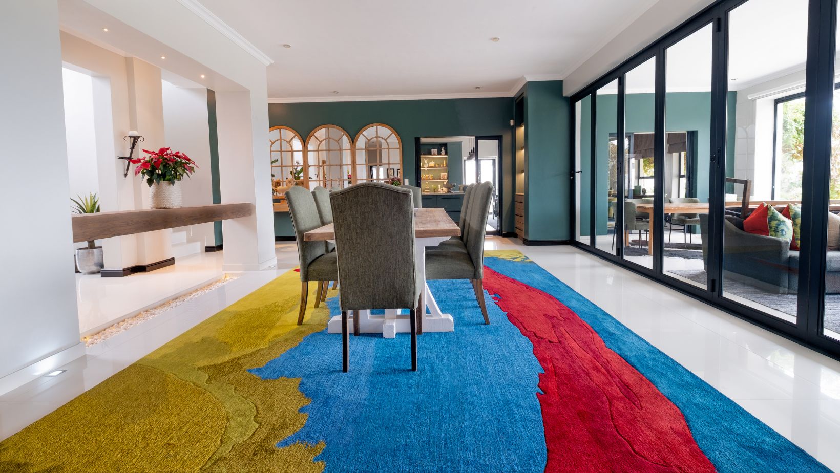 large wool rug placed underneath dining room table