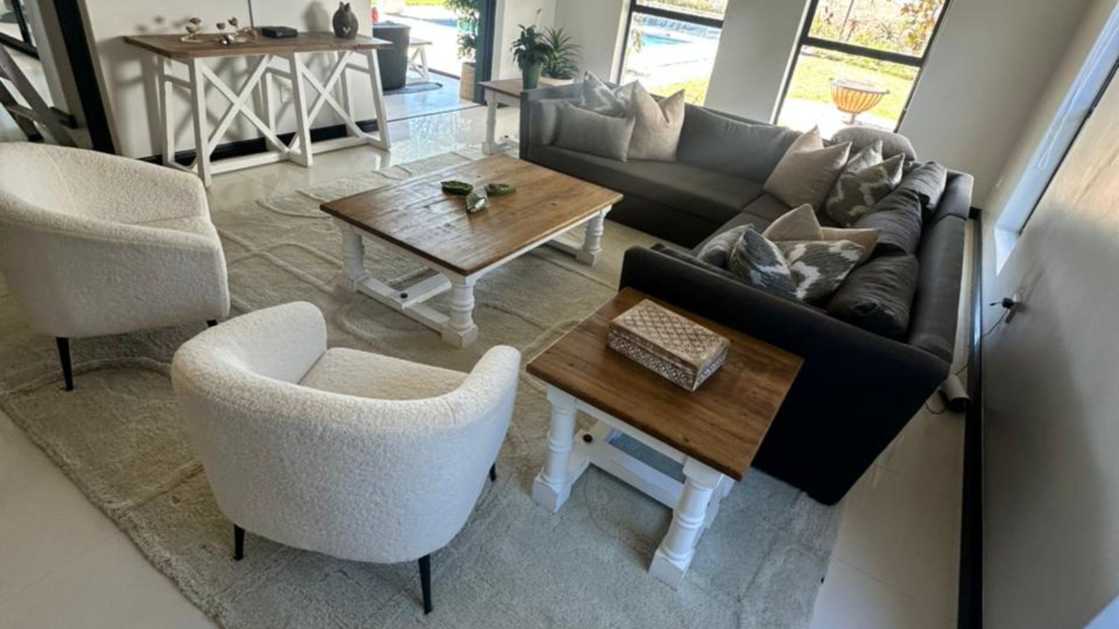 large area rug placed underneath sofa's