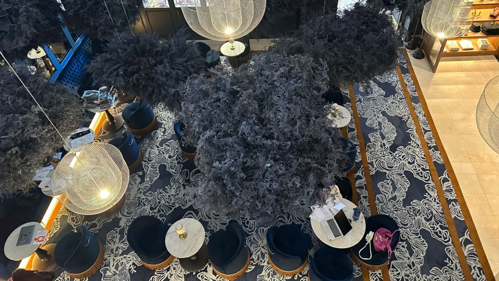 a large handtufted rug with an artists drawing placed in a lounge area
